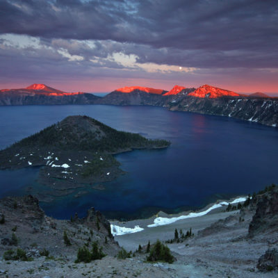 Sunset illuminates Mount Scott and Garfield Peak at Crater Lake National Park in Oregon.