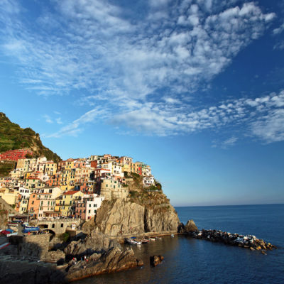 Manarola as perched on a rocky cliff along the Mediterranean Sea in Italy.
